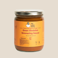 Delicious Goan Vindaloo simmering sauce made with tomatoes, red chili, vinegar, perfect for Indian cuisine. Authentic flavor for curries and rice dishes.
