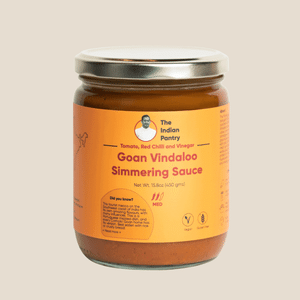 Delicious Goan Vindaloo simmering sauce made with tomatoes, red chili, vinegar, perfect for Indian cuisine. Authentic flavor for curries and rice dishes.