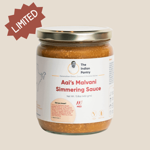 Vegan, gluten-free, authentic Indian cooking sauce with caramelized onion, coconut, and roasted spices in a glass jar. Limited edition flavorful Malvani cuisine condiment.